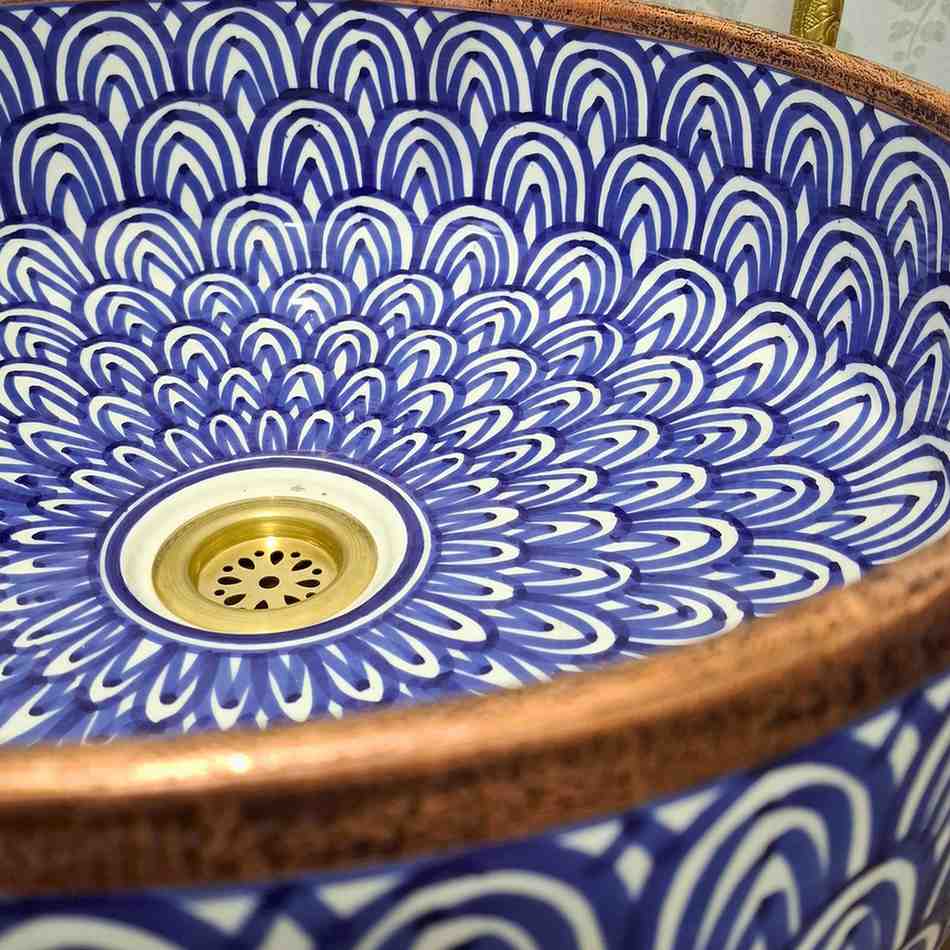 Blue Moroccan vessel sink with rose brass rim