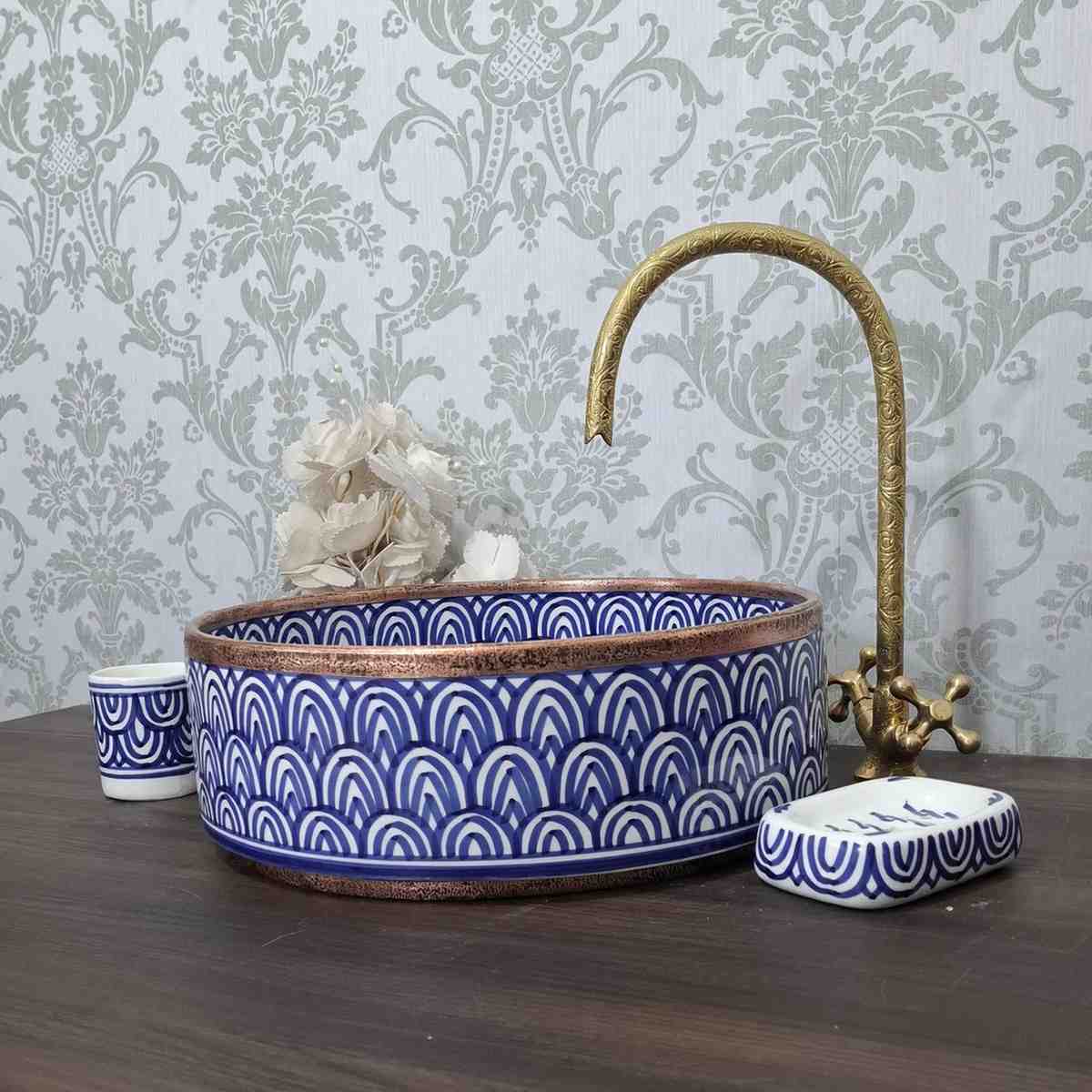 Blue Moroccan vessel sink with rose brass rim