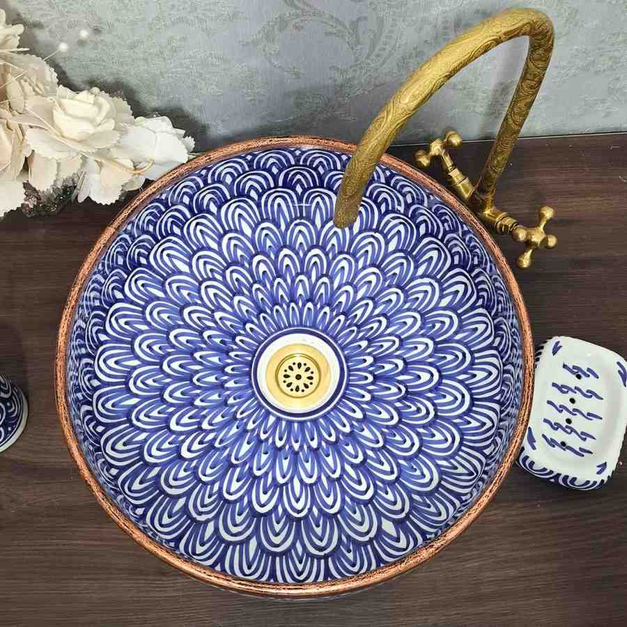 Blue Moroccan vessel sink with rose brass rim
