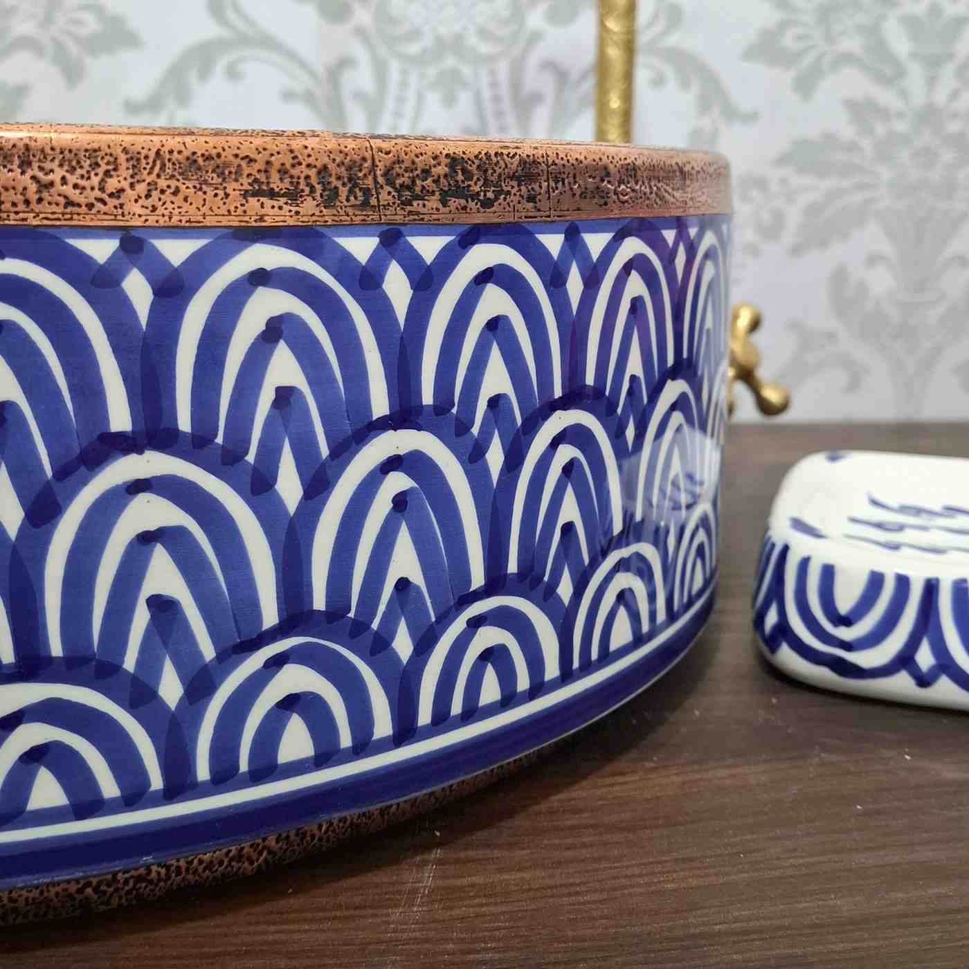 Blue Moroccan vessel sink with rose brass rim