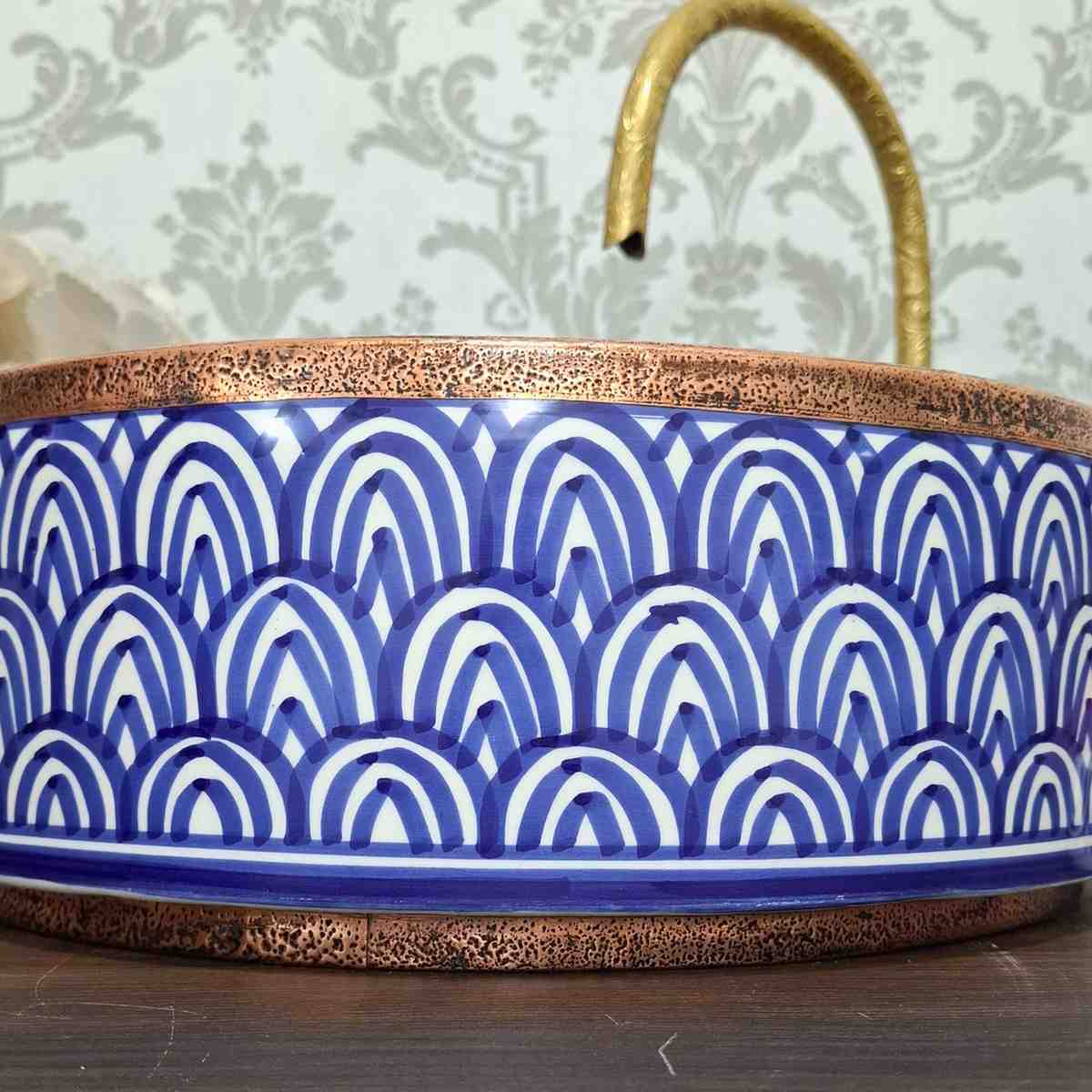 Blue Moroccan vessel sink with rose brass rim