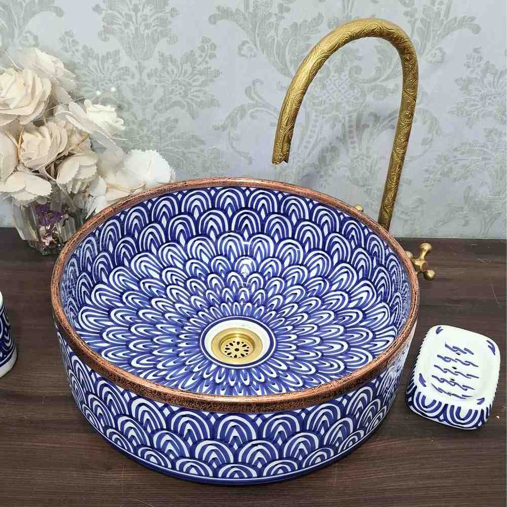 Blue Moroccan vessel sink with rose brass rim